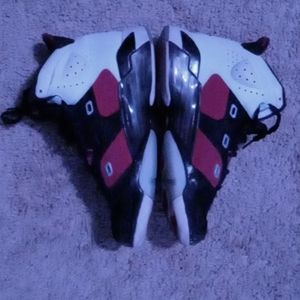 These are Jordan 6, black and red with a white heel. Selling both shoes.